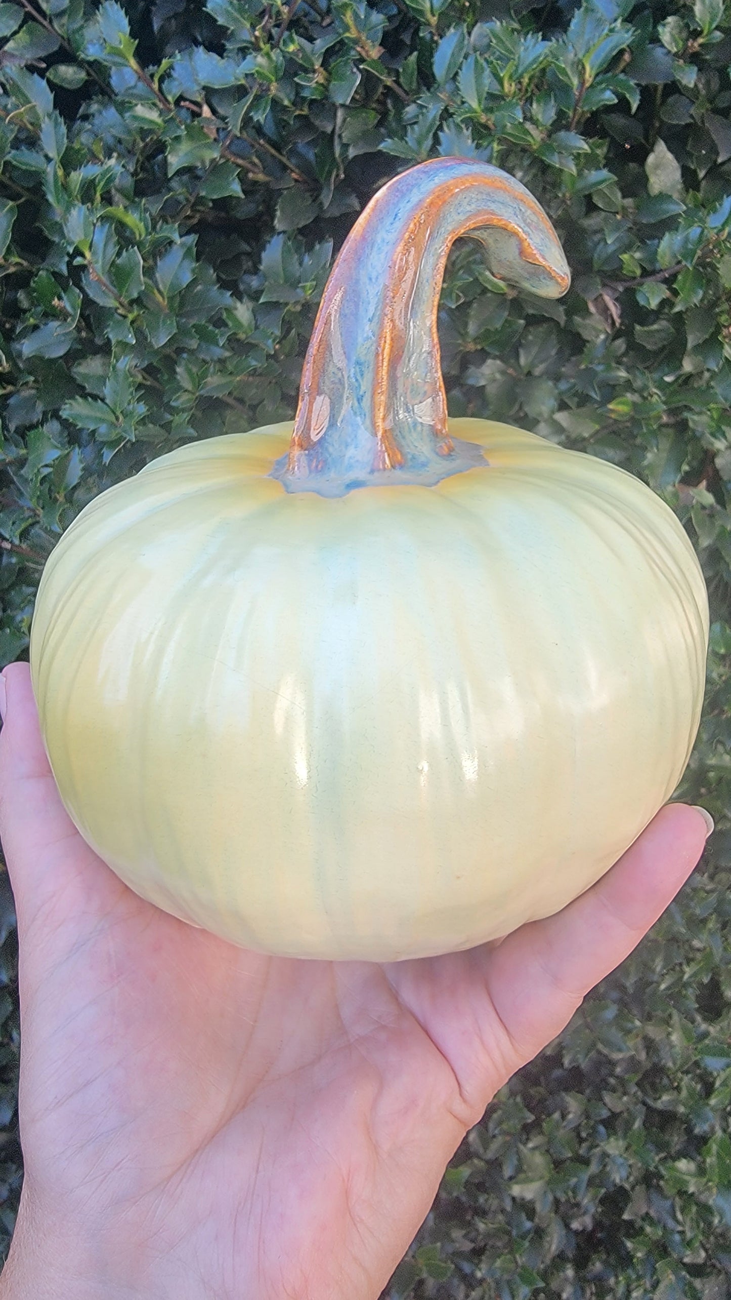 Pumpkin, honeydew colored with blushes of yellow orange.