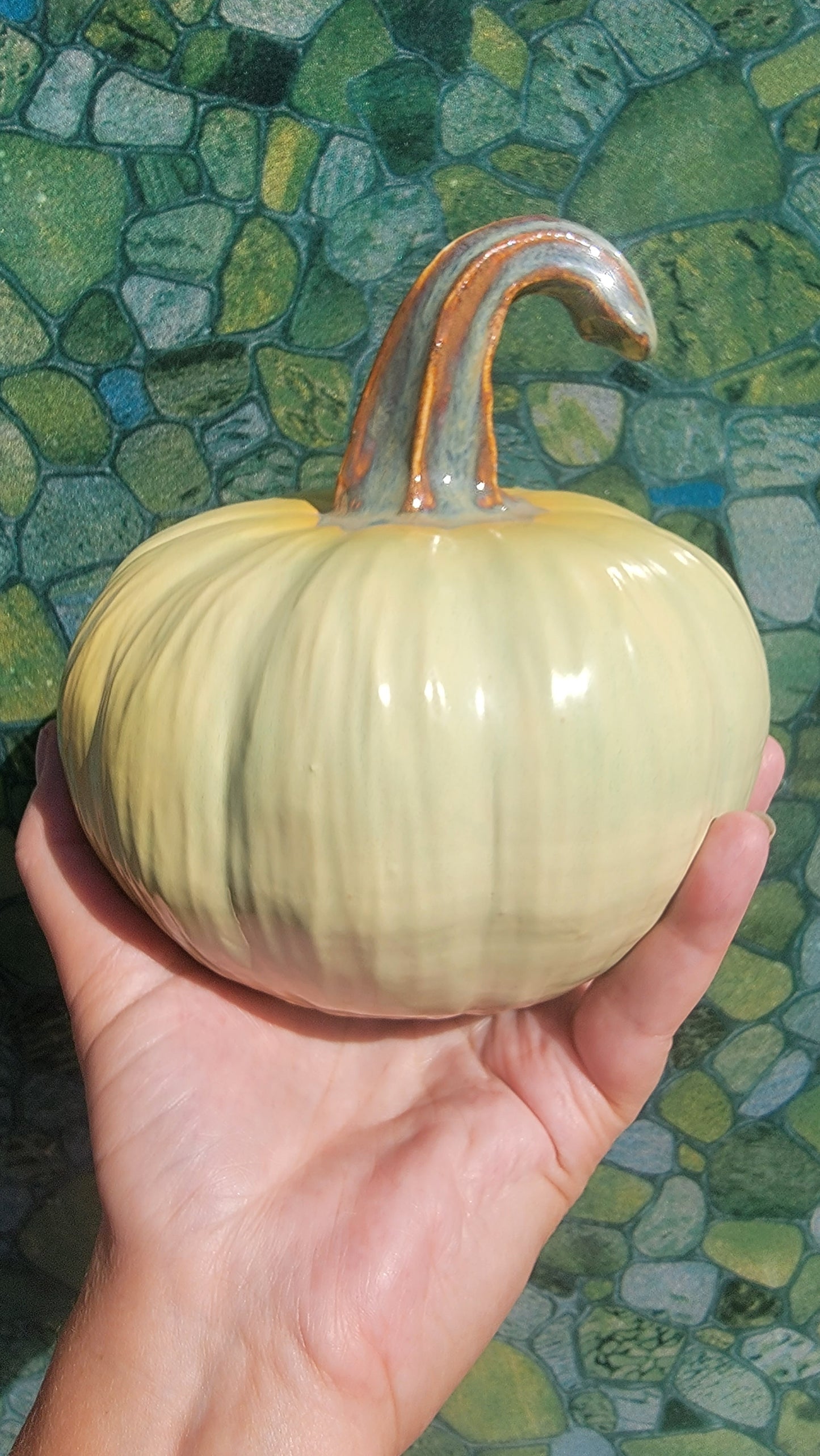 Pumpkin, honeydew colored with blushes of yellow orange.